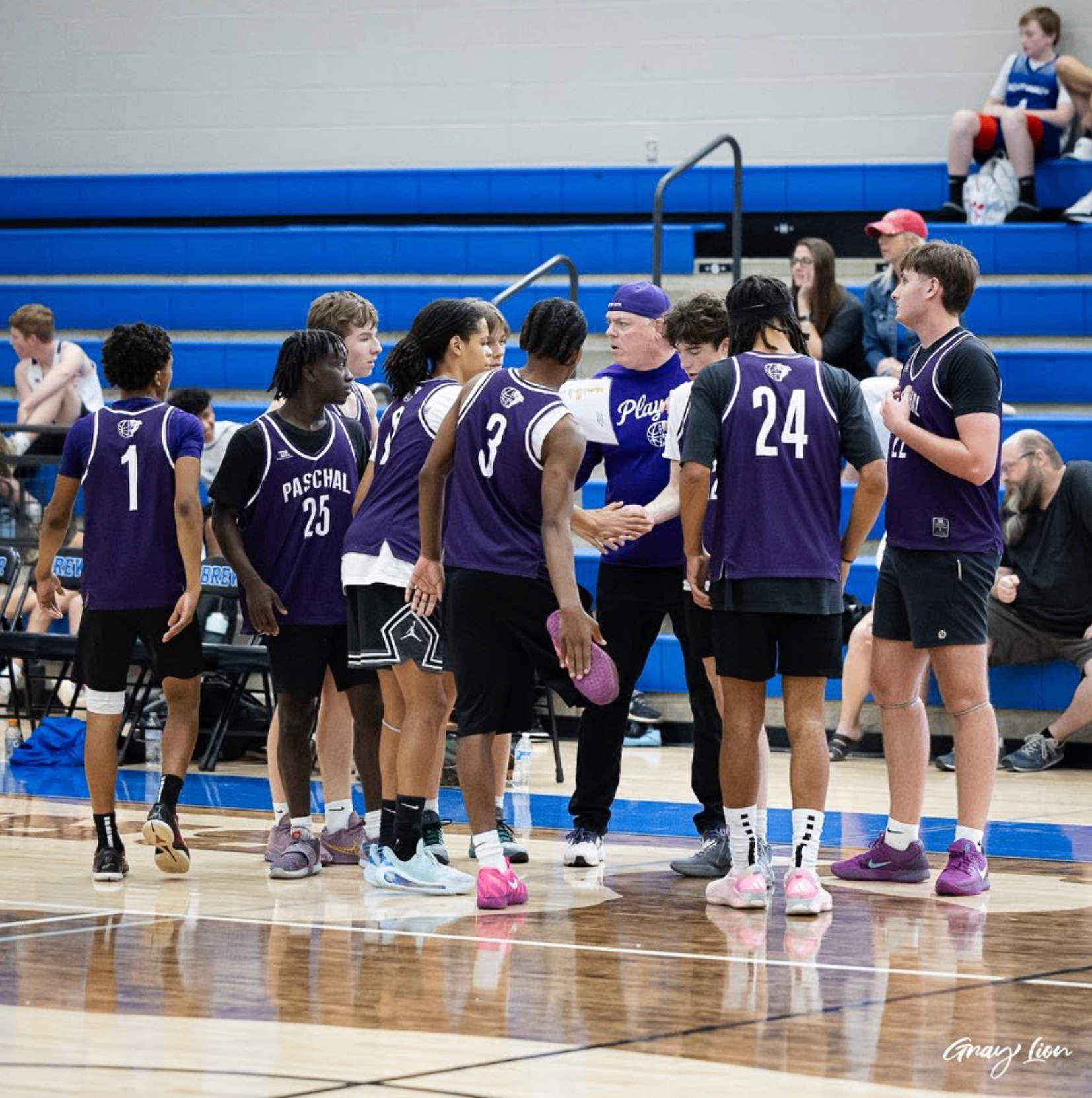 Paschal team gathers on the court between plays